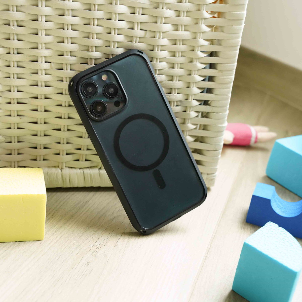 Catalyst-iPhone-15-pro-max-protective-stylish-drop-proof-iphone-cases-dropping-in-front-of toy-basket-near-blocks.png