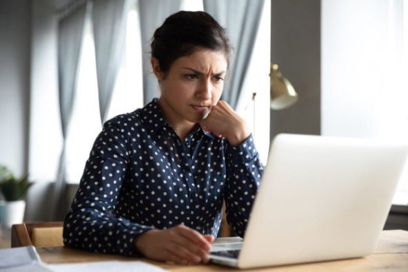 Person_looking_at_a_laptop_computer 2.jpg