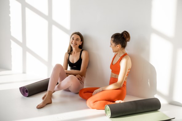 Two women resting after their yoga workout (1).jpg