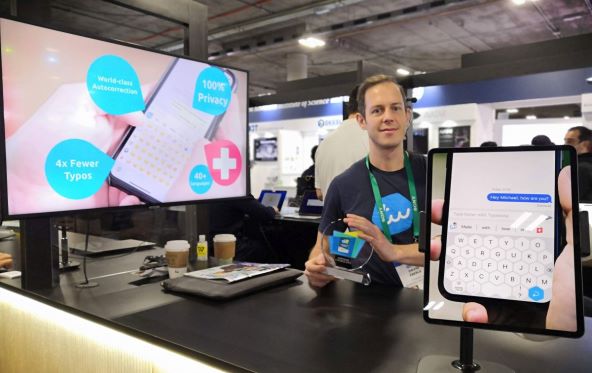 David Eberle Typewise CEO at CES2022 booth.jpg